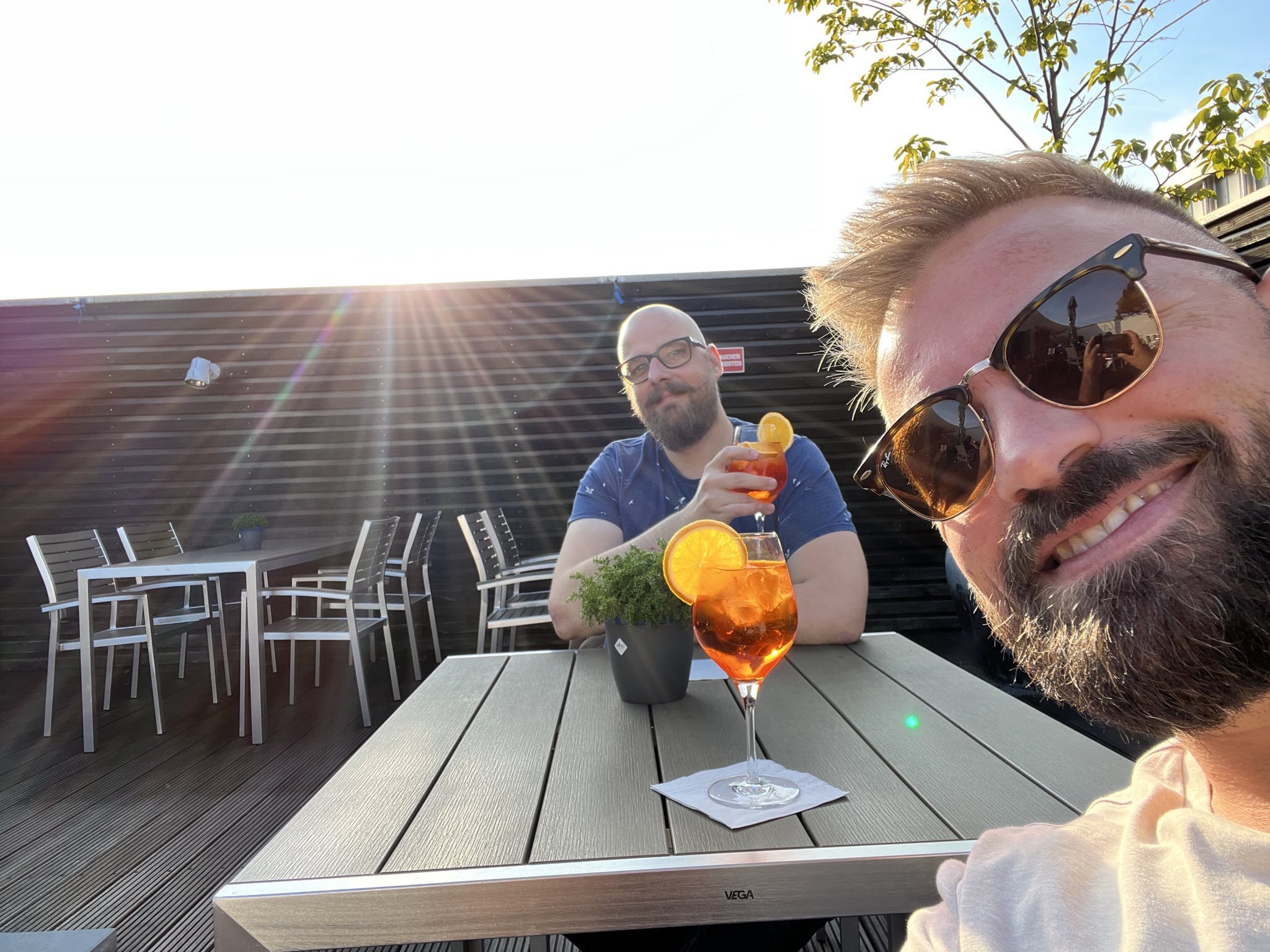 AJ and Kevin enjoying a cocktail together on the rooftop of the Aspria